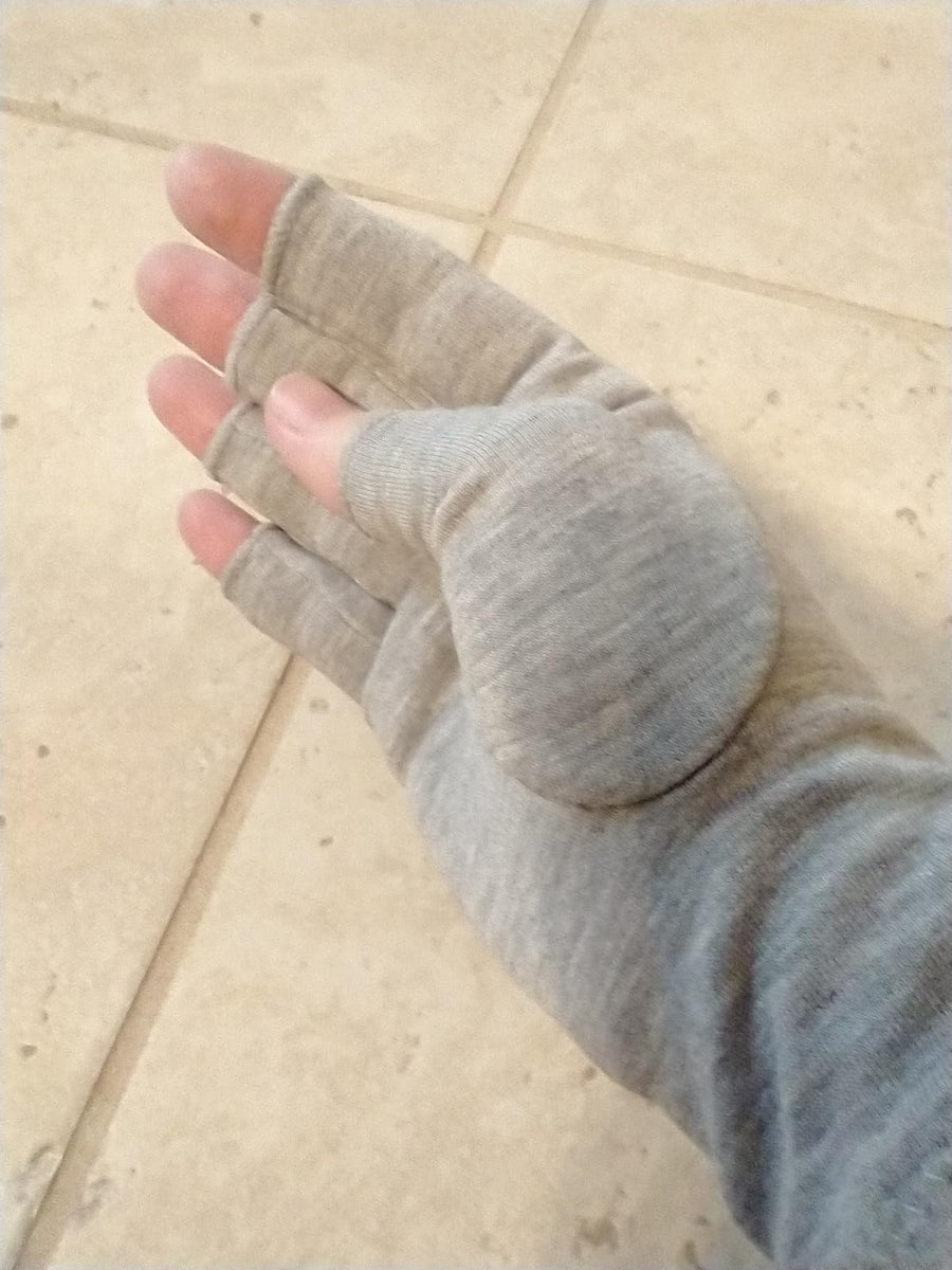 Customer wearing gray compression gloves