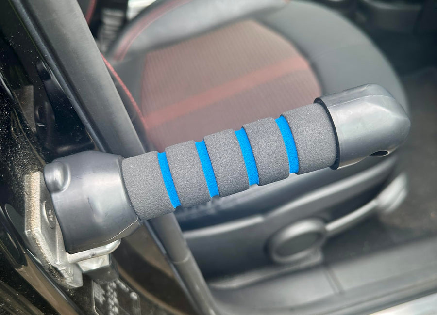 The handle seated in a car door striker