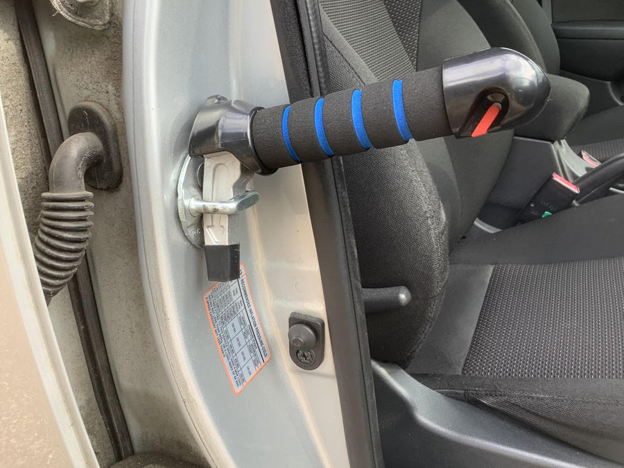 The handle seated in a car door striker
