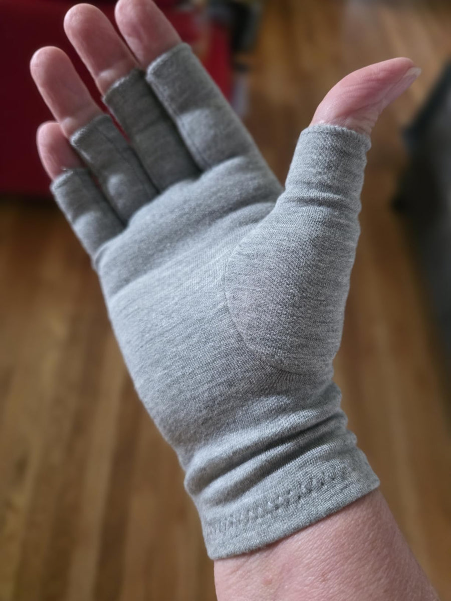 Customer wearing gray compression gloves