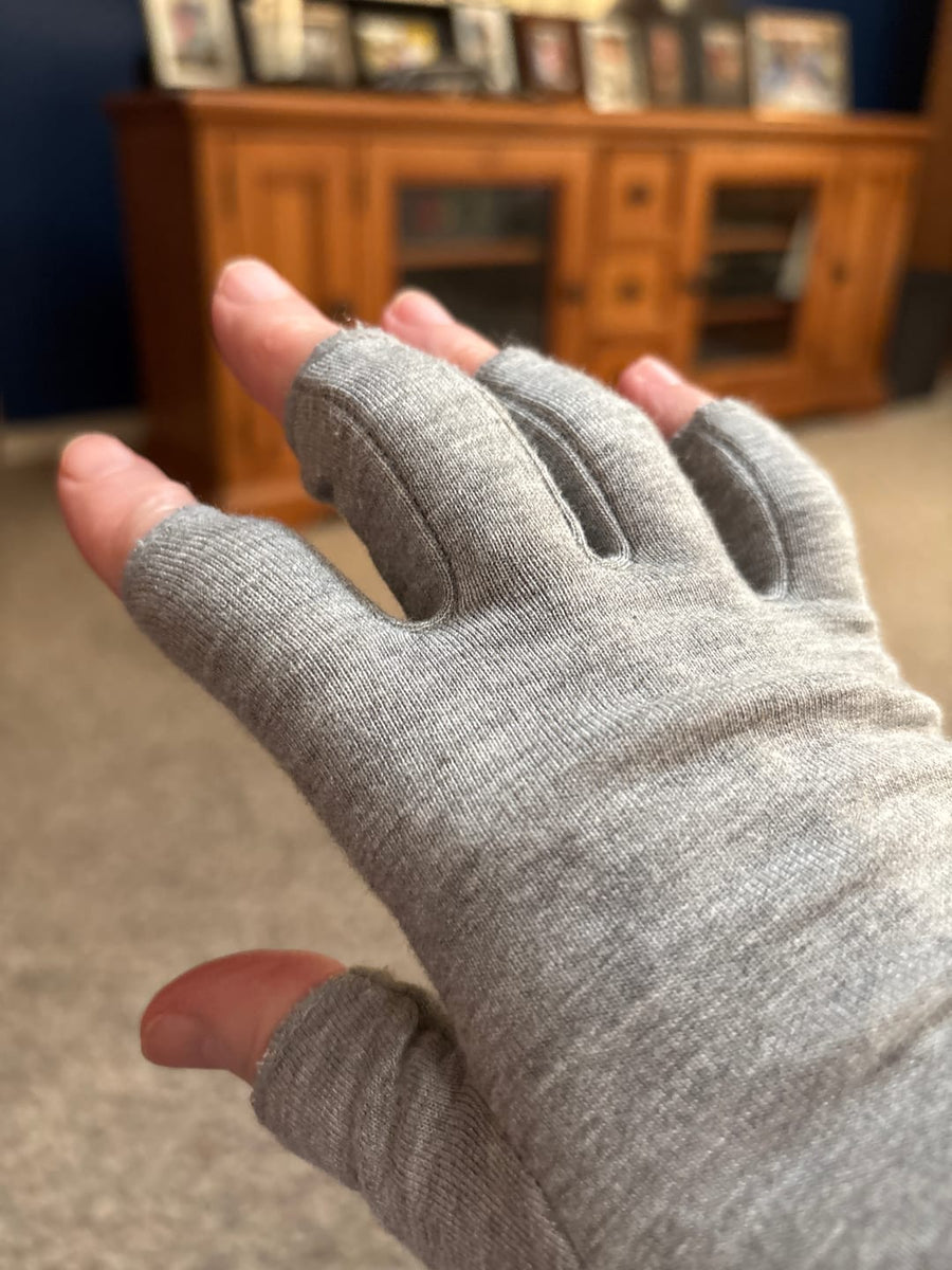 Customer wearing gray compression gloves