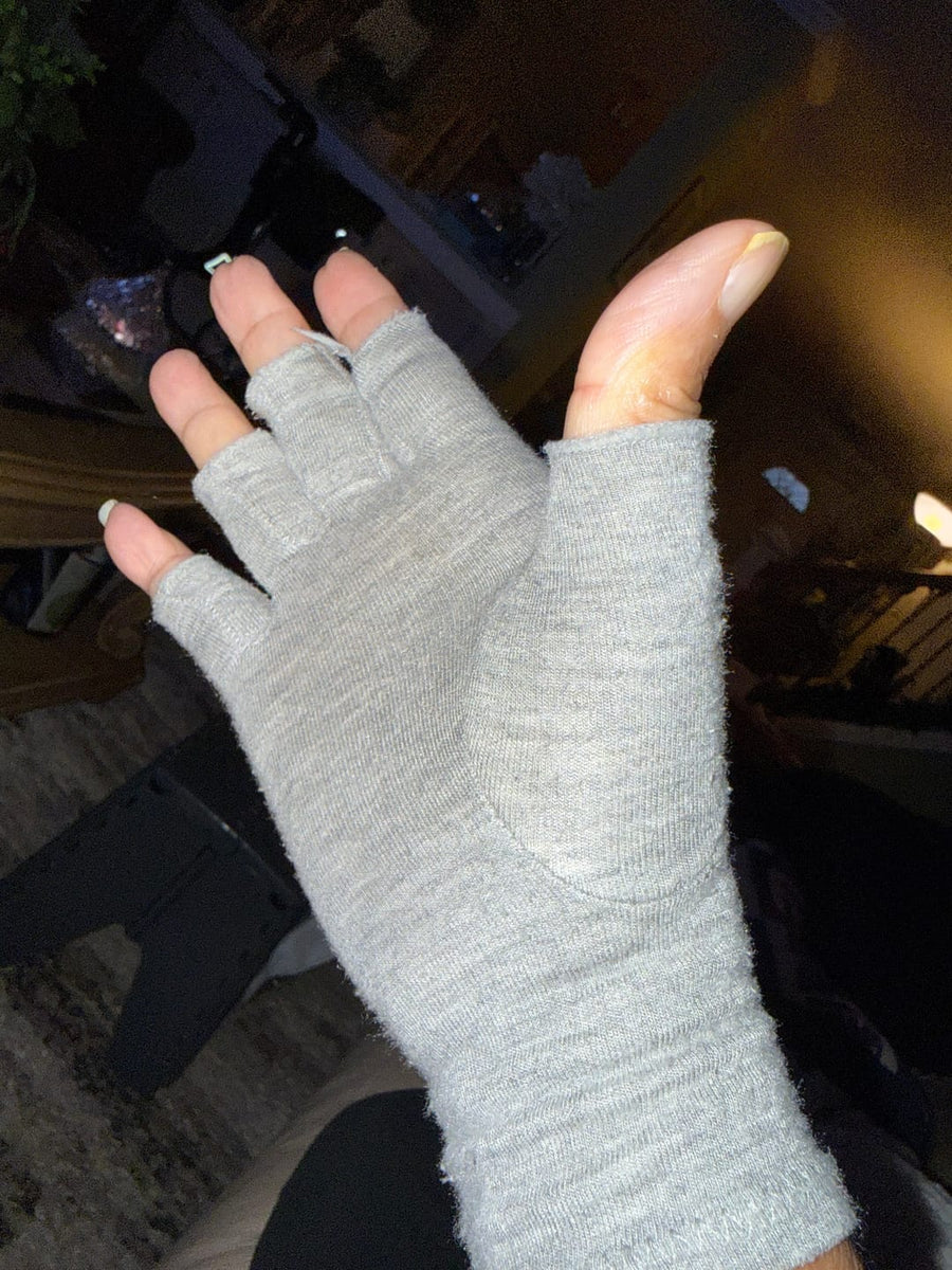 Customer wearing gray compression gloves