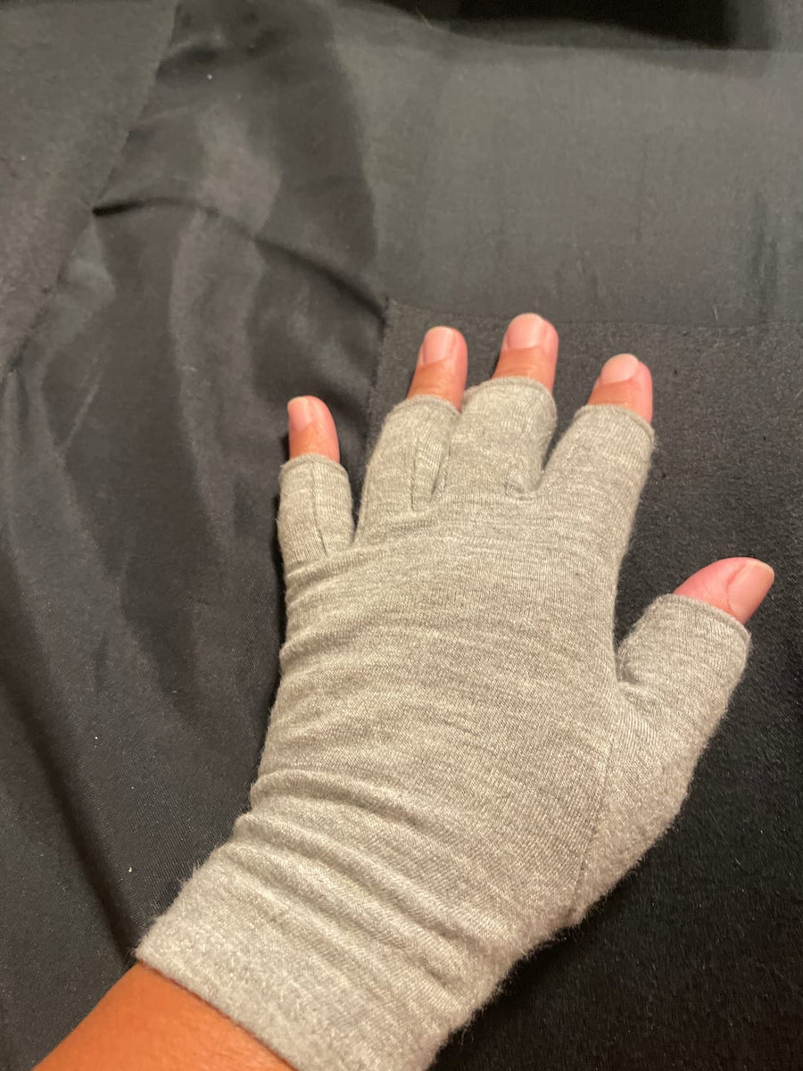 Customer wearing gray compression gloves