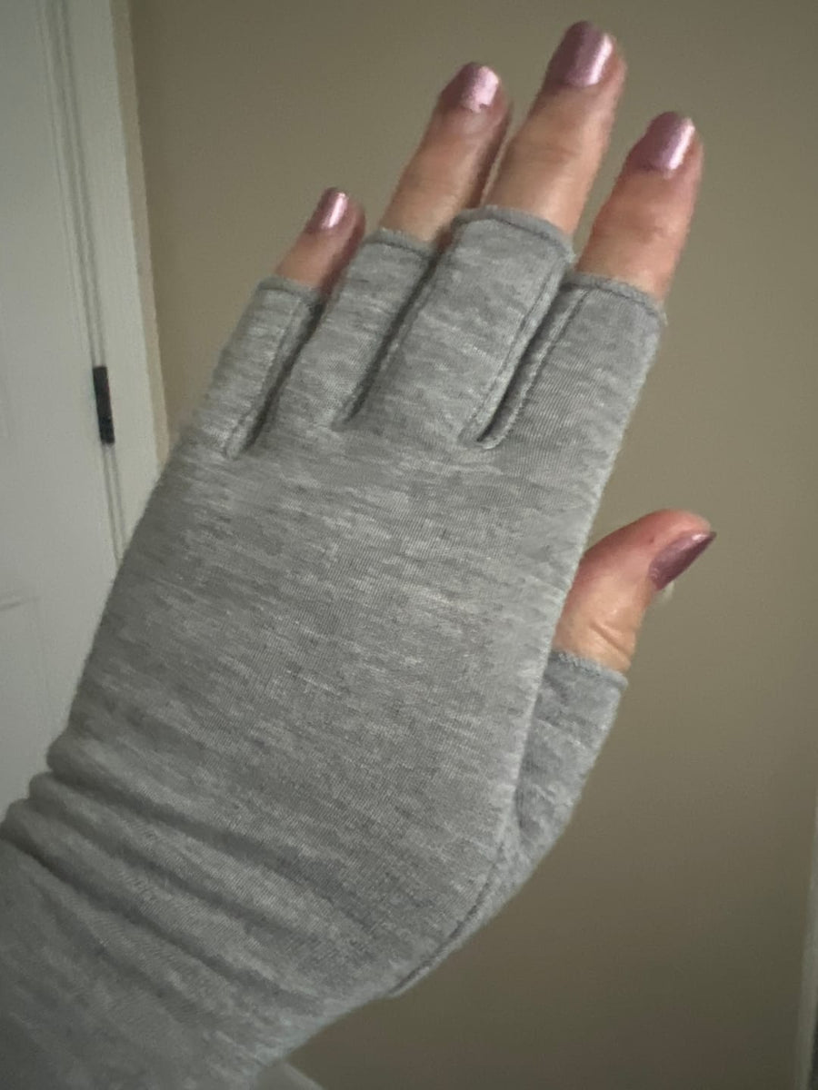 Customer wearing gray compression gloves